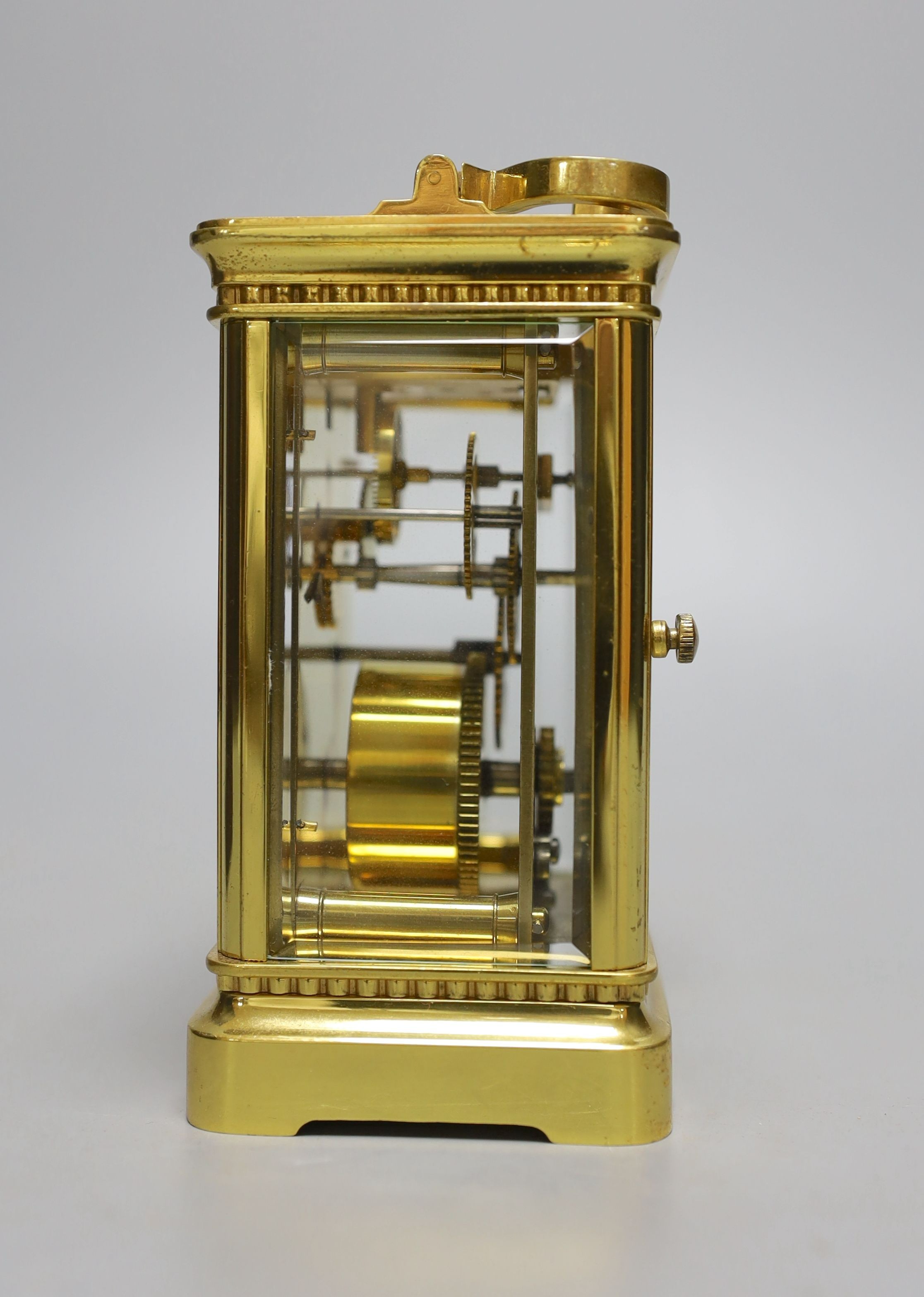 A cased French gilt brass carriage timepiece with relief cast dial and engraved presentation inscription - 14cm tall